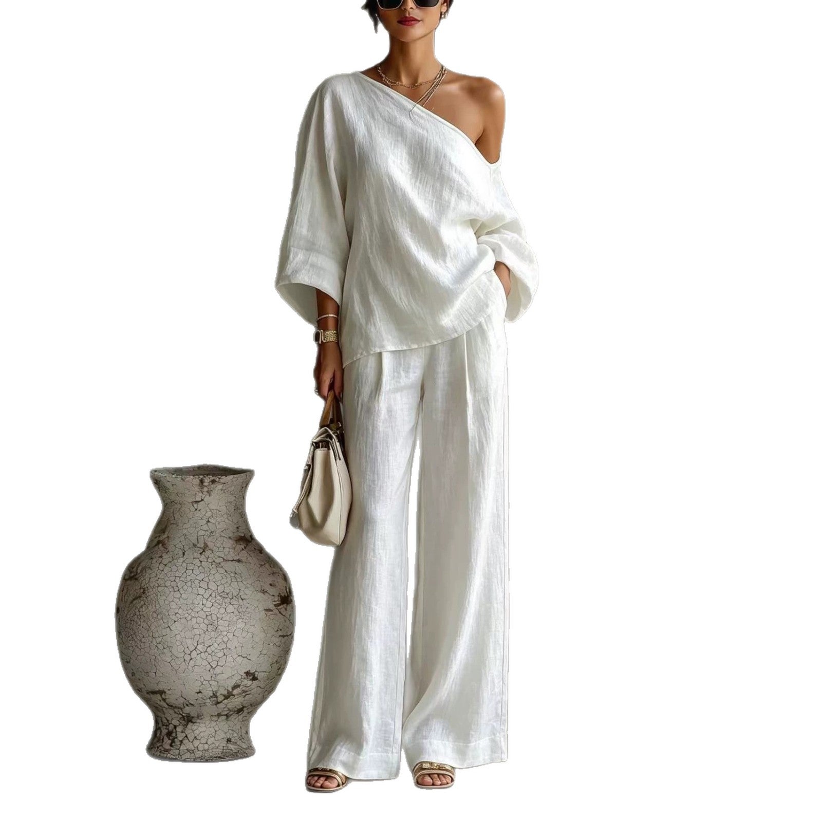 Elegant set consisting of an off-the-shoulder top and wide-leg trousers, in a casual and relaxed style.
