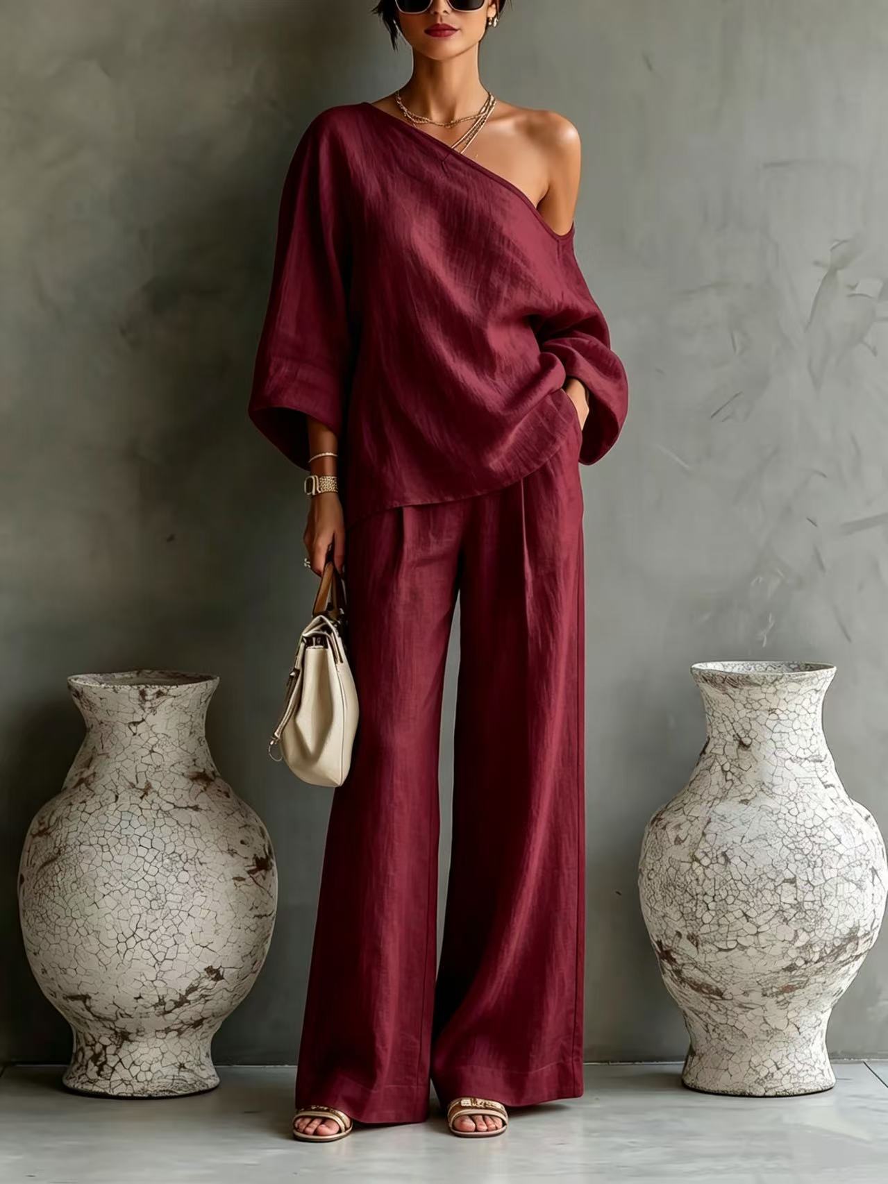 Elegant set consisting of an off-the-shoulder top and wide-leg trousers, in a casual and relaxed style.